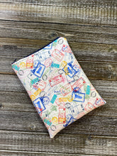 Load image into Gallery viewer, Globetrotter Travel Stamps Padded Book Sleeve | BookGoodies | Book Pocket | Protective Book Bag | Book Pouch | Bookish Nerd Gift
